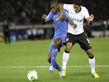Corinthians' Paulinho tackles Ramires for the ball during the game with Chelsea on December 16, 2012