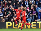 MK Dons player Ryan Lowe celebrates scoring for his side in their FA Cup fourth round tie with QPR on January 26, 2013