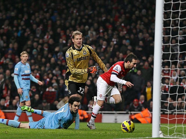 Santi Cazorla scores his team's third goal against West Ham on January 23, 2013