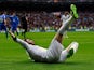 Sergio Ramos slides on the floor as he celebrates scoring the opening goal against Getafe on January 27, 2013