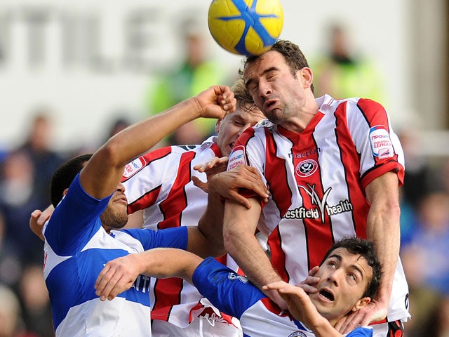 Sheffield United's Danny Higginbotham wins a header for his side in their match against Reading on January 26, 2013