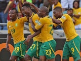 South Africa's Siyabonga Sangweni is congratulated by team mates after scoring the opener in the Africa Cup of Nations match against Angola on January 23, 2013