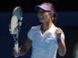 China's Li Na celebrates after defeating Maria Sharapova in the semifinal of the Australian Open tennis championship on January 24, 2013