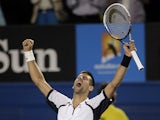 Novak Djokovic celebrates defeating Tomas Berdych at the Australian Open tennis championship on January 22, 2013