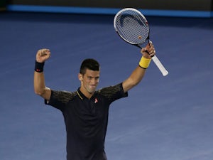 Serbia's Novak Djokovic celebrates defeating David Ferrer in their semifinal match at the Australian Open tennis championship on January 24, 2013