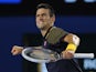 Novak Djokovic celebrates defeating David Ferrer at the Australian Open tennis championship on January 24, 2013