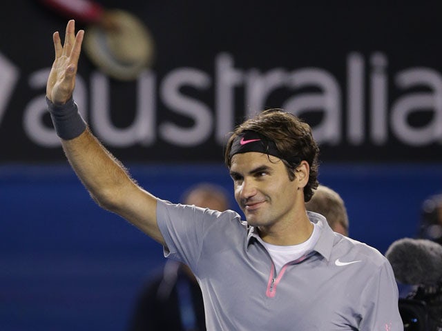 Federer eases past Raonic