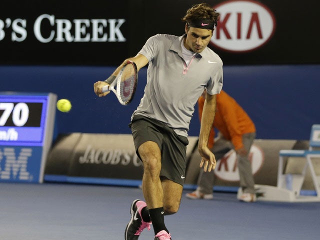 Roger Federer in action against Andy Murray in their semifinal match at the Australian Open tennis championship on January 25, 2013