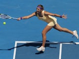 Victoria Azarenka from Belarus stretches for the ball in her fourth round match at the Australian Open tennis championship on January 21, 2013