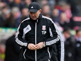 Stoke City manager Tony Pulis looks at the ground moments after the final whistle as his team loses to Manchester City in the FA Cup fourth round on January 26, 2013