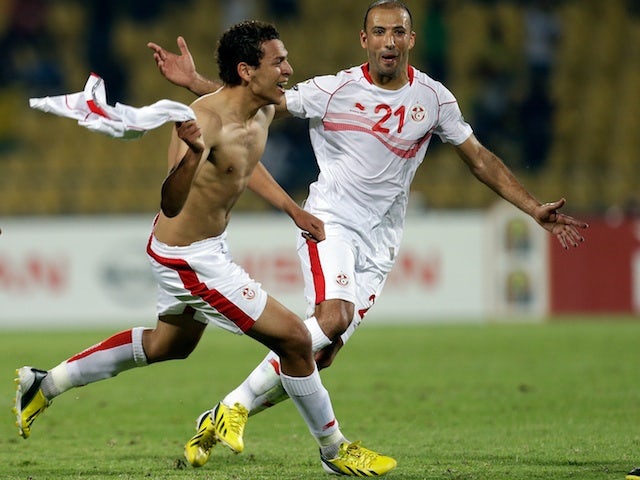 Tunisia's Youssef M'sakni celebrates his winner against Algeria on January 22, 2013