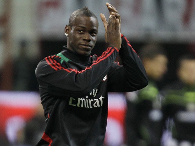 New AC Milan signing Mario Balotelli warms up prior to his side's match with Udinese on February 3, 2013