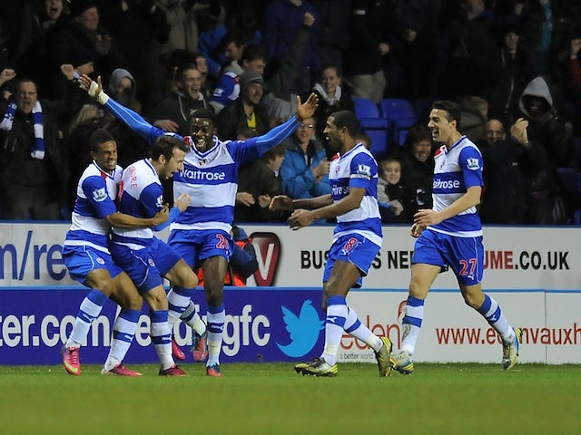 Reading's Adam Le Fondre celebrates with teammates after a stoppage time equaliser against Chelsea on January 30, 2013