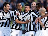 Siena's Alessio Sestu is congratulated by team mates after scoring his team's second against Inter on February 3, 2013