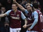 West Ham's Andy Carroll celebrates with teammates after giving his side the lead against Swansea on February 2, 2013