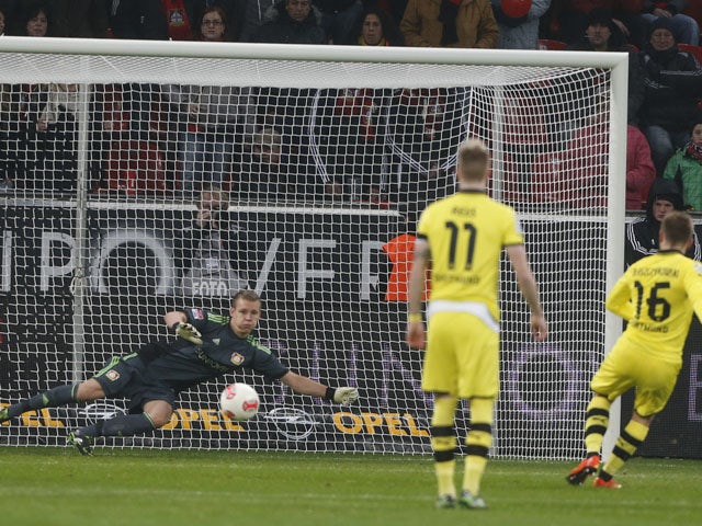 Dortmund player Jakub Blaszczykowski scores from the penalty spot in his team's game with Bayer Leverkusen on February 3, 2013