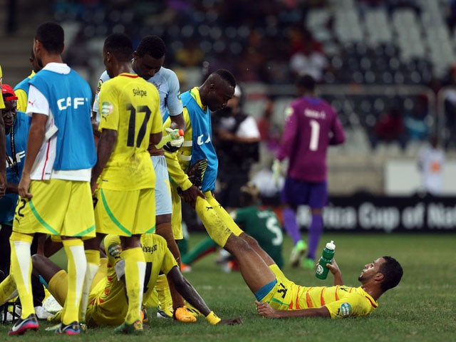 Togo's Alaixys Romao receives treatment during extra time in his side's African Cup of Nations quarter final match on February 3, 2013