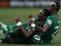 Burkina Faso player Jonathan Pitroipa celebrates with a teammate after scoring an extra time goal against Togo in the African Cup of Nations quarter final on February 3, 2013