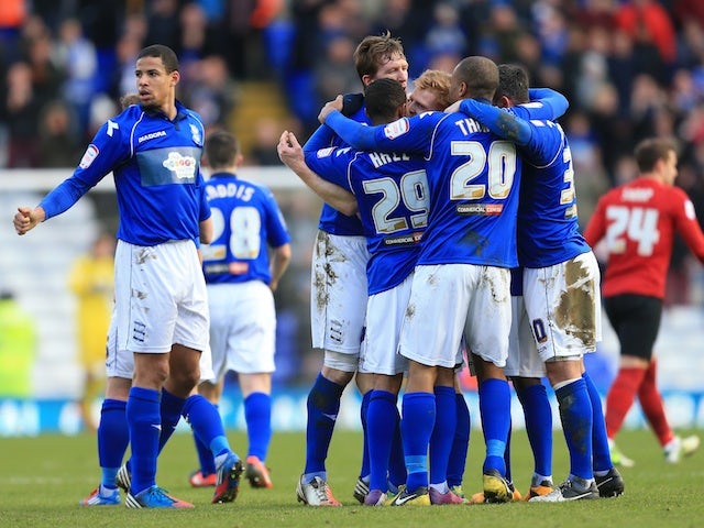 Birmingham players surround Chris Burke following his goal against Forest on February 2, 2013