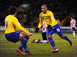 Coventry City player Leon Clarke celebrates with a teammate after scoring his sides opening goal in their match with Sheffield United on February 1, 2013
