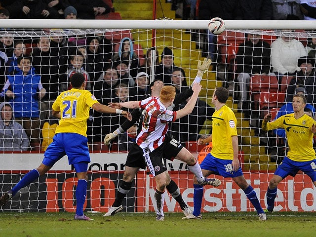 Sheffield United's Dave Kitson heads the equalising goal in his team's game with Coventry City on February 1, 2013