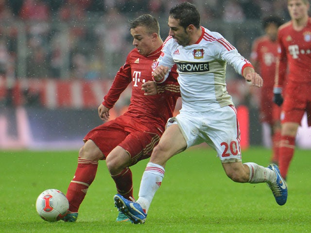 Bayer Leverkusen player Daniel Carvajal (right) challenges for the ball with Bayern Munich player Xherdan Shaqiri during their sides match on October 28, 2012