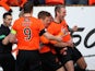 Johnny Russell celebrates with his Dundee United teammates after scoring the first goal in their match against Rangers on February 2, 2013