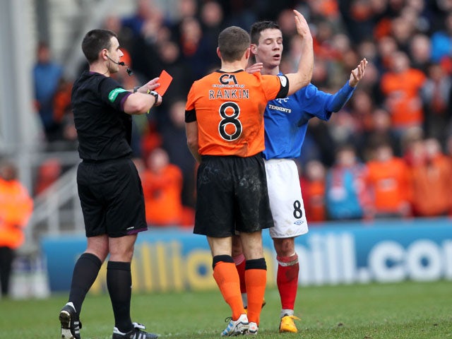 Rangers player Ian Black is shown a red card in his side's match with Dundee United on February 2, 2012
