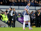 Goran Popov makes his way off the field after being shown a straight red card in the match against Tottenham on February 3, 2013