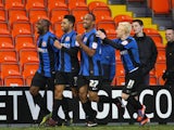 Barnsley's Jason Scotland is congratulated by teammates after a goal against Blackpool on February 2, 2013