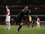 Liverpool's Luis Suarez celebrates after giving his team the lead against Arsenal on January 30, 2013