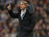 Manchester City manager Roberto Mancini gives instructions on the touchline during his side's match with Liverpool on February 3, 2013