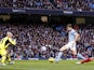 Manchester City forward Edin Dzeko scores the first goal of his side's match with Liverpool on February 3, 2013