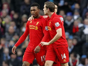 Liverpool striker Daniel Sturridge is congratulated by teammates after scoring against Manchester City on February 3, 2013