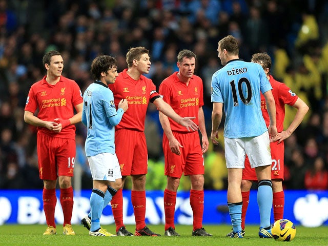 Liverpool captain Steven Gerrard and Manchester City froward Edin Dzeko exchange words following Liverpool's goal in the team's clash on February 3, 2013