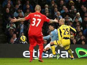 Manchester City striker Sergio Aguero scores his team's second goal on February 3, 2013 