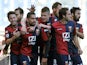 Genoa's Marco Borriello is congratulated by team mates after scoring the opening goal against Lazio on February 3, 2013