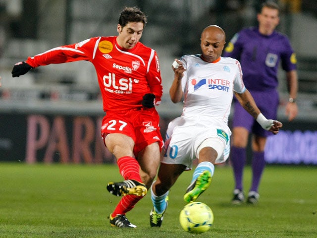 Nancy player Thomas Ayasse and Marseille forward Andre Ayew challenge for the ball in their team's clash on February 3, 2013