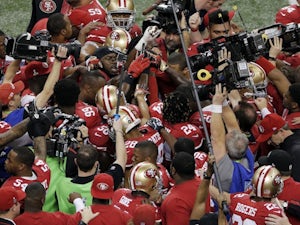 49ers players huddle before Superbowl 47 on February 3, 2013