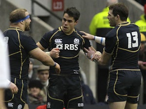 Scotland's Sean Maitland celebrates with teammates after scoring a try against England on February 2, 2013
