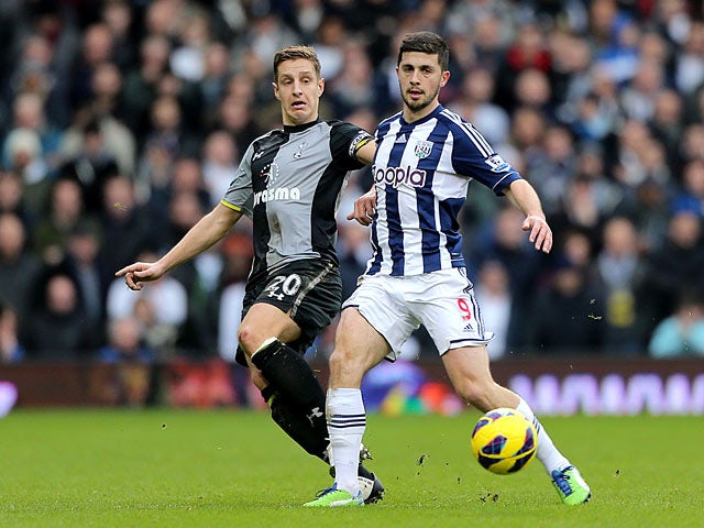 Shane Long and Michael Dawson battle for the ball on February 3, 2013