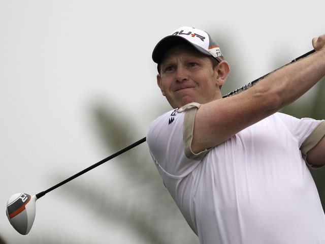 Scotland's Stephen Gallacher tees off on the 9th hole at the Dubai Desert Classic Golf tournament on February 2, 2013