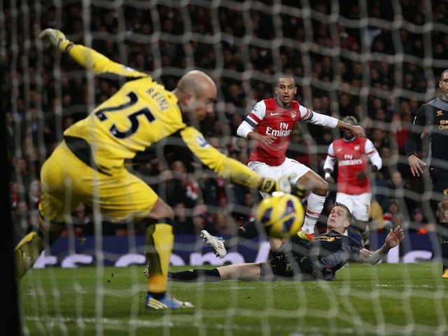 Arsenal's Theo Walcott smashes in an equaliser against Liverpool on January 30, 2013