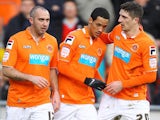 Blackpool players congratulate Tom Ince following his goal against Barnsley on February 2, 2013
