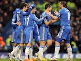 Chelsea players congratulate Eden Hazard after he scored his team's second goal against Wigan on February 9, 2013