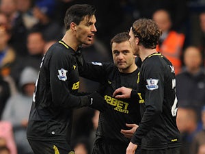 Shaun Maloney (centre) celebrates with his Wigan teammates after scoring against Chelsea on February 9, 2013