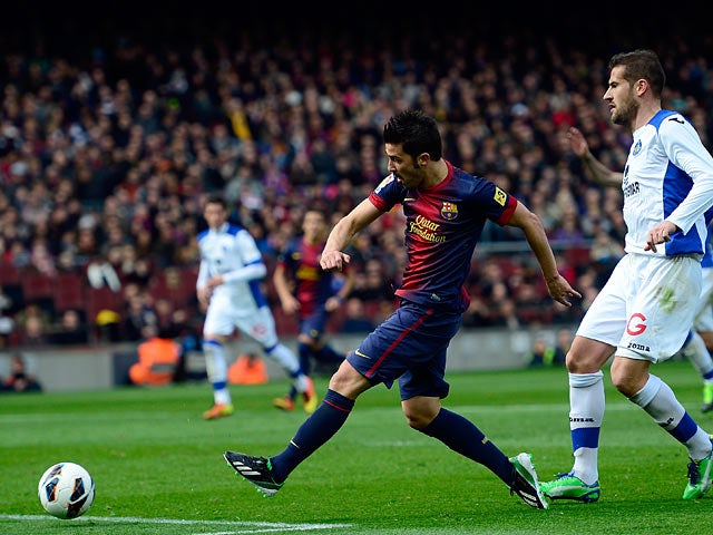 Barcelona's David Villa scores his team's third against Getafe on February 10, 2013
