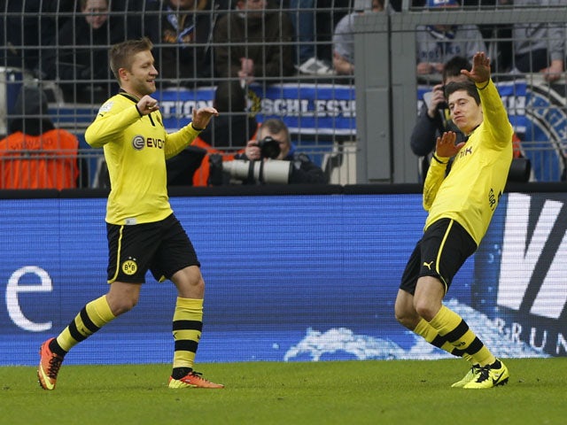 Dortmund's Robert Lewandowski celebrates opening the scoring in his team's match against Hamburg on February 9, 2013