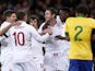 England players celebrate with Frank Lampard after he scored his side's second goal against Brazil on February 6, 2013