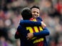 Barcelona's Lionel Messi is congratulated by team mate Thiago after scoring against Getafe on February 10, 2013